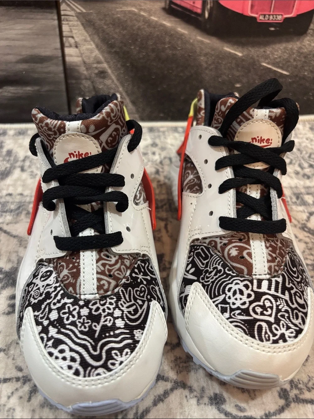 Nike Huarache Kids White Sneakers with Black Pattern, Orange & Yellow Accents